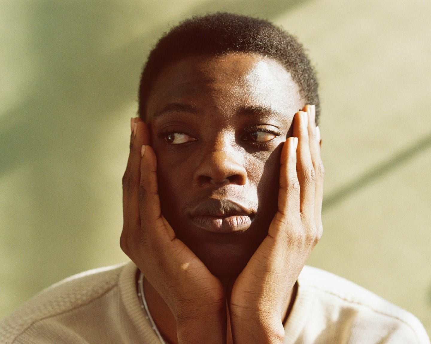 Man holding head in his hands