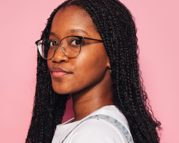 woman with braids and glasses