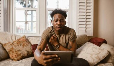 sad man looking at iPad