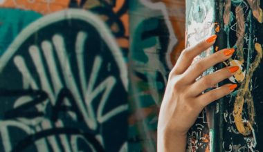 woman hiding behind corner