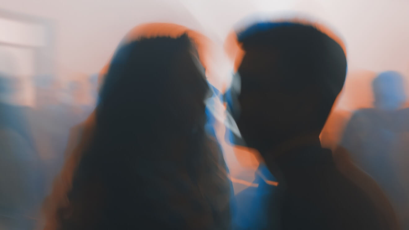 Silhouette of man and woman in nightclub