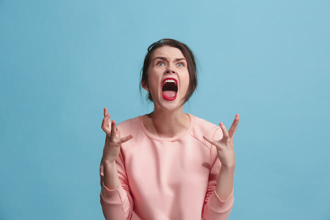 A woman screaming in anger