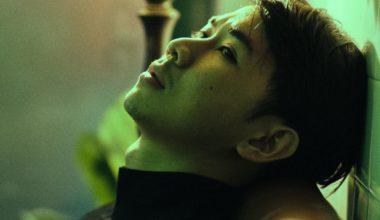 Man gazing towards the void through green light