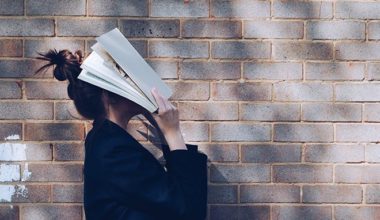 Person with face in book