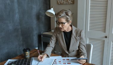 An old lady taking notes on a notepad