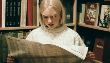 woman reading newspaper
