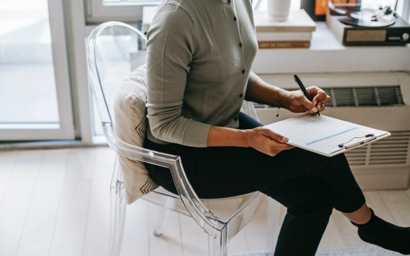 therapist-writing-on-clipboard