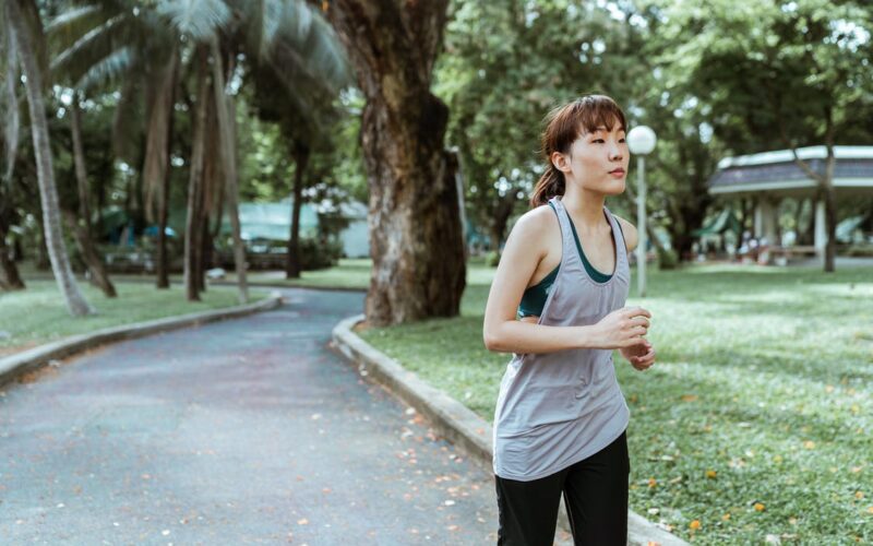 woman running down street