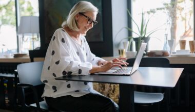 woman smiling looking at computer