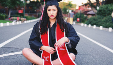Worried woman in graduation gown