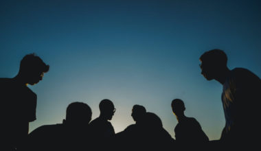 silhouette of people sitting