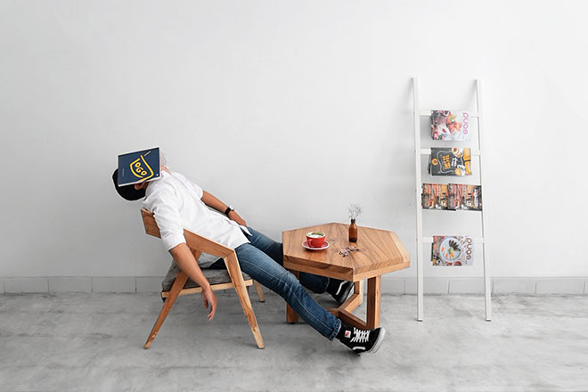 Man sleeping with a book on his face