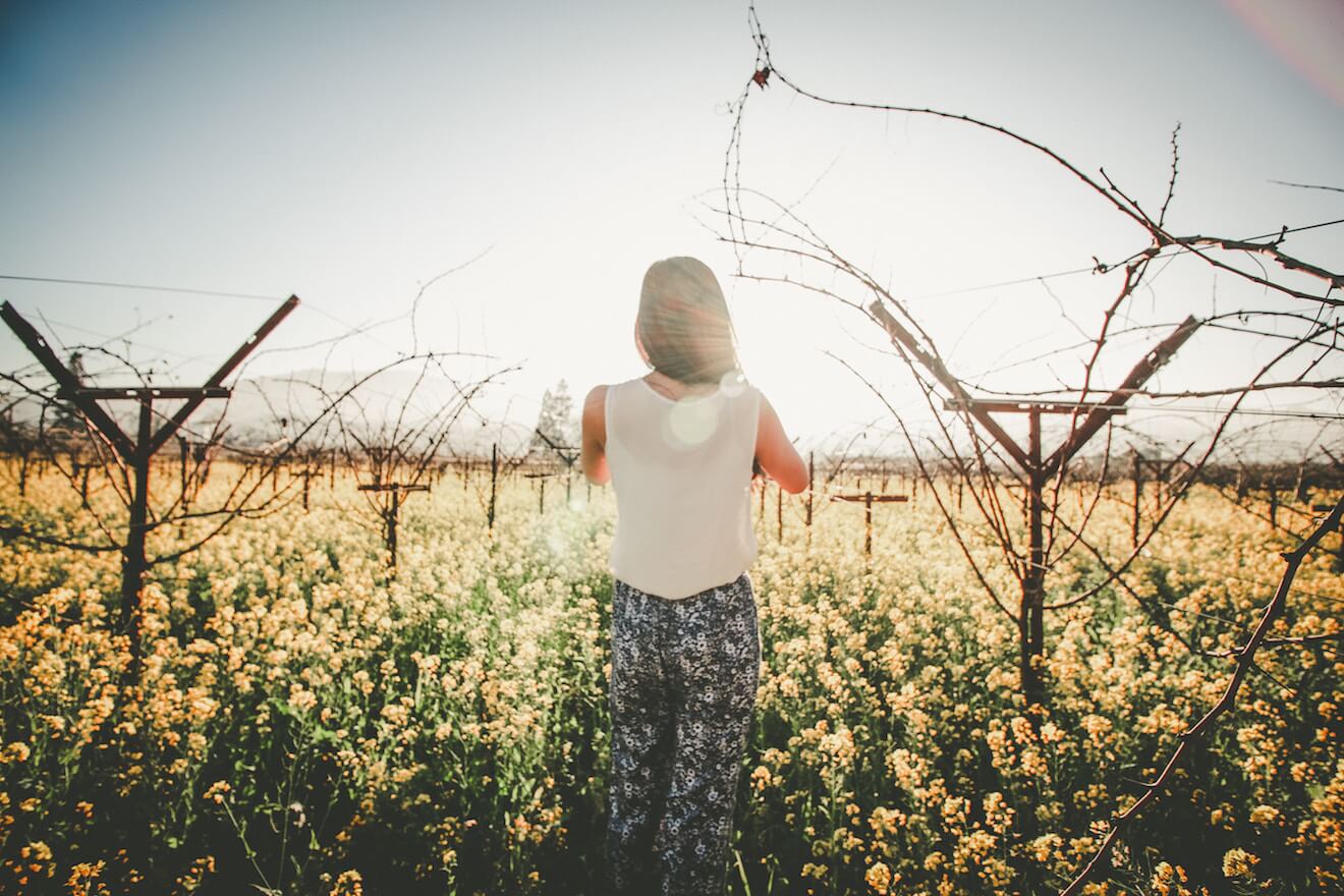 Woman in field of flowers
