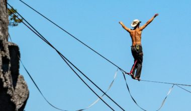 Guy balancing on a high rope