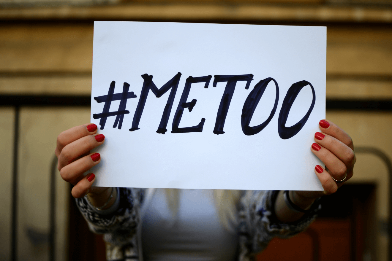 woman holding #METOO sign