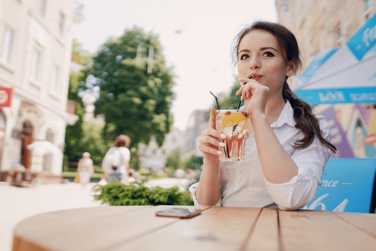 woman drinking table alone