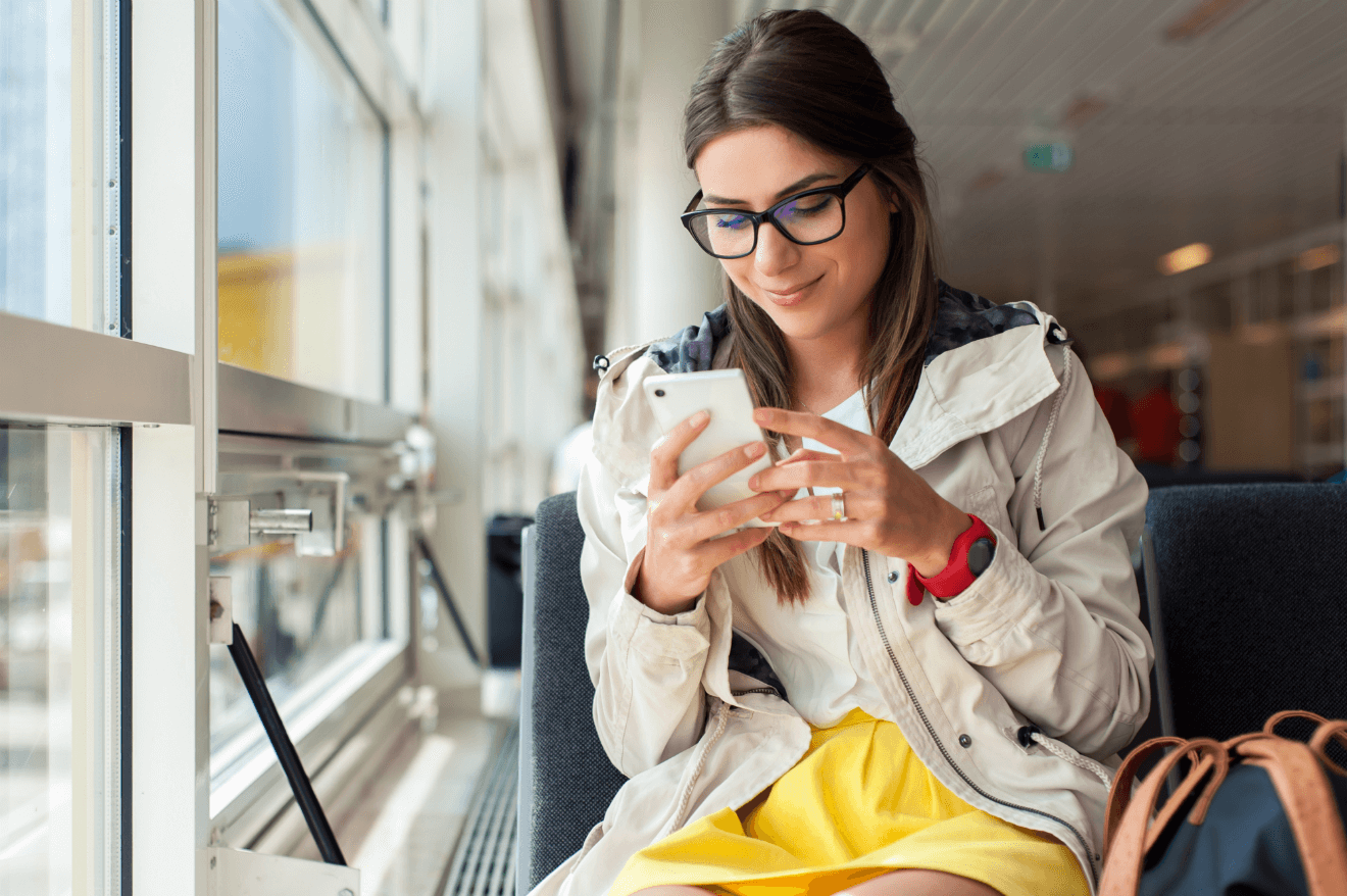 Woman on phone traveling